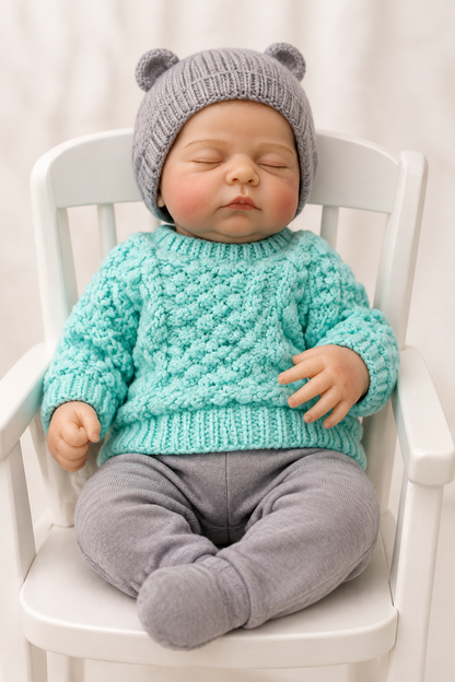 JONNY reborn doll boy hat covering head in high chair