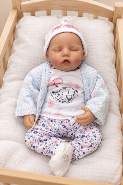 Kerry asleep in cot