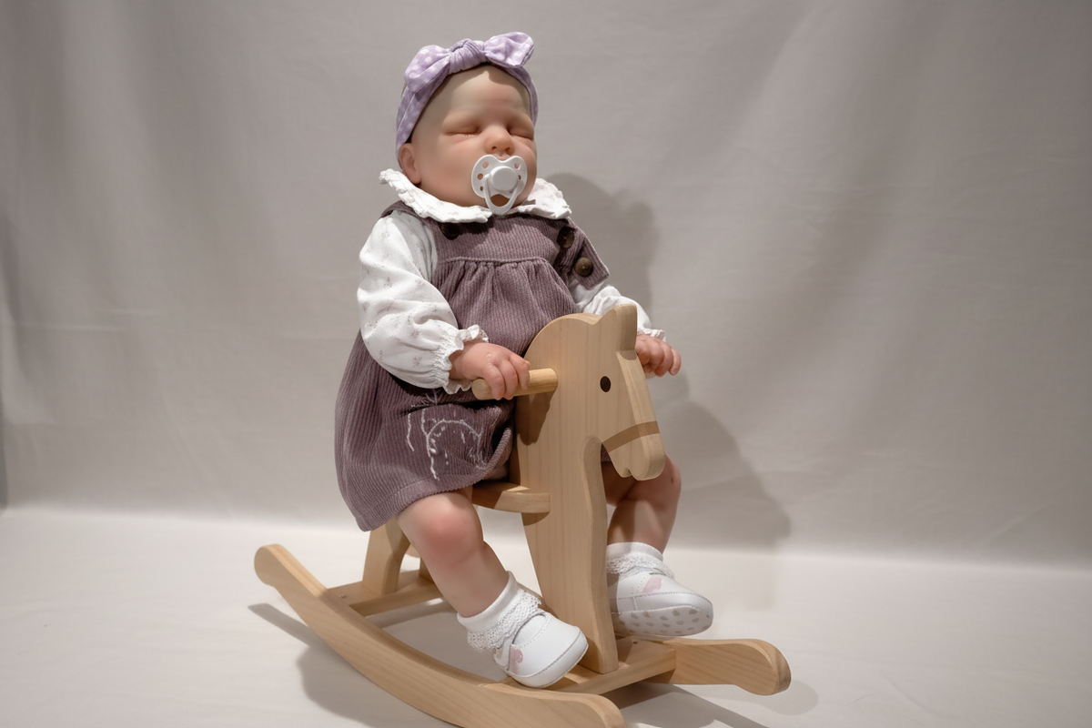 Reborn Doll on Rocking Horse
