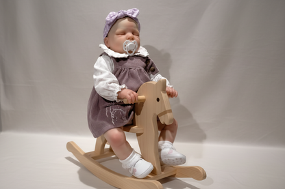 Reborn Doll on Rocking Horse
